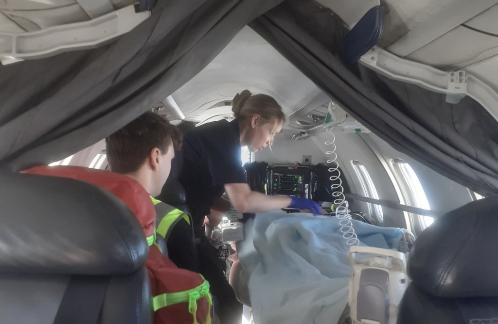 patient being attended my a nurse in a medical flight